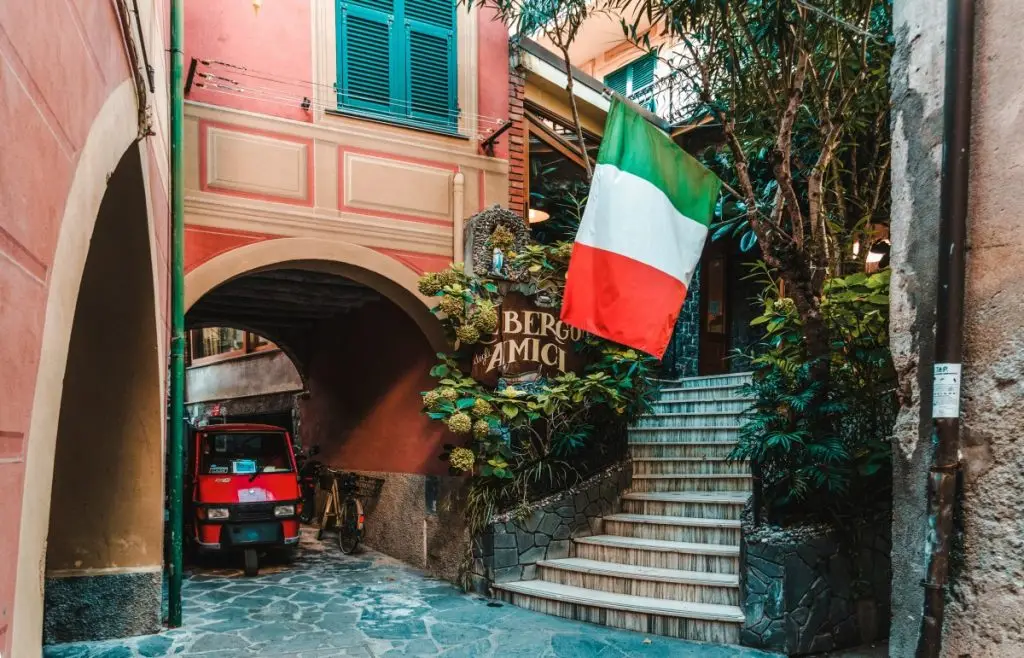 red auto-rickshaw under arch walkway